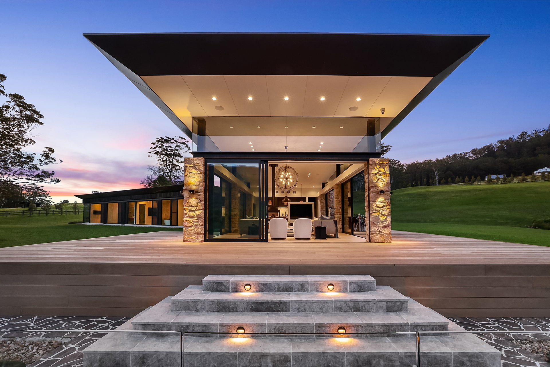 Photo of an architectural home featuring Millboard composite decking