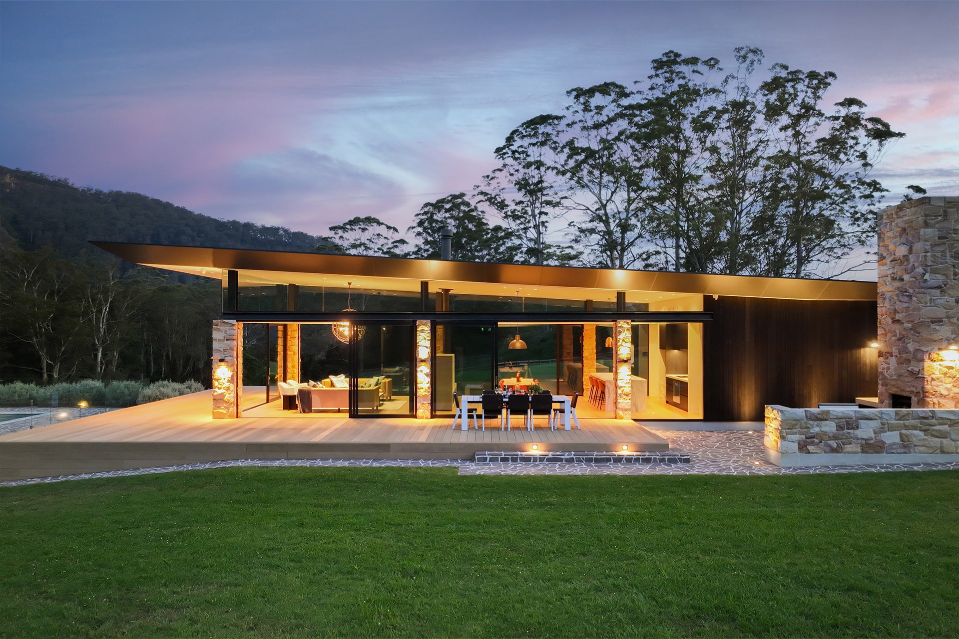 Outdoor dining and fireplace around composite deck